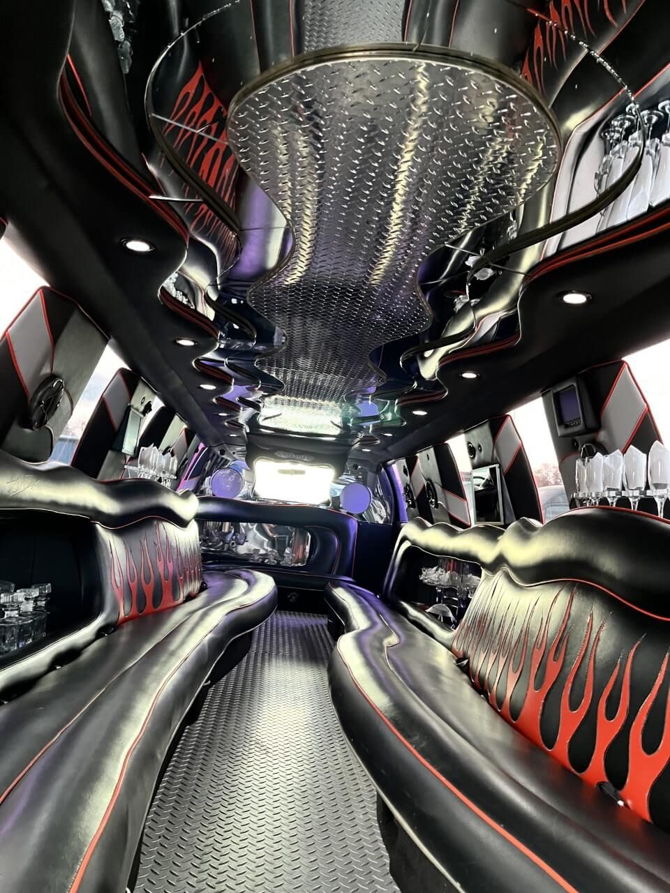 F250 limousine interior looking down the cabin, flame upholstery and mirrored ceiling
